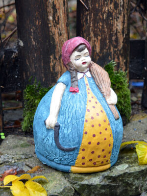 Handmade ceramic girl with alstroemeria