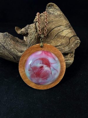 Handmade round necklace from resin and wood.